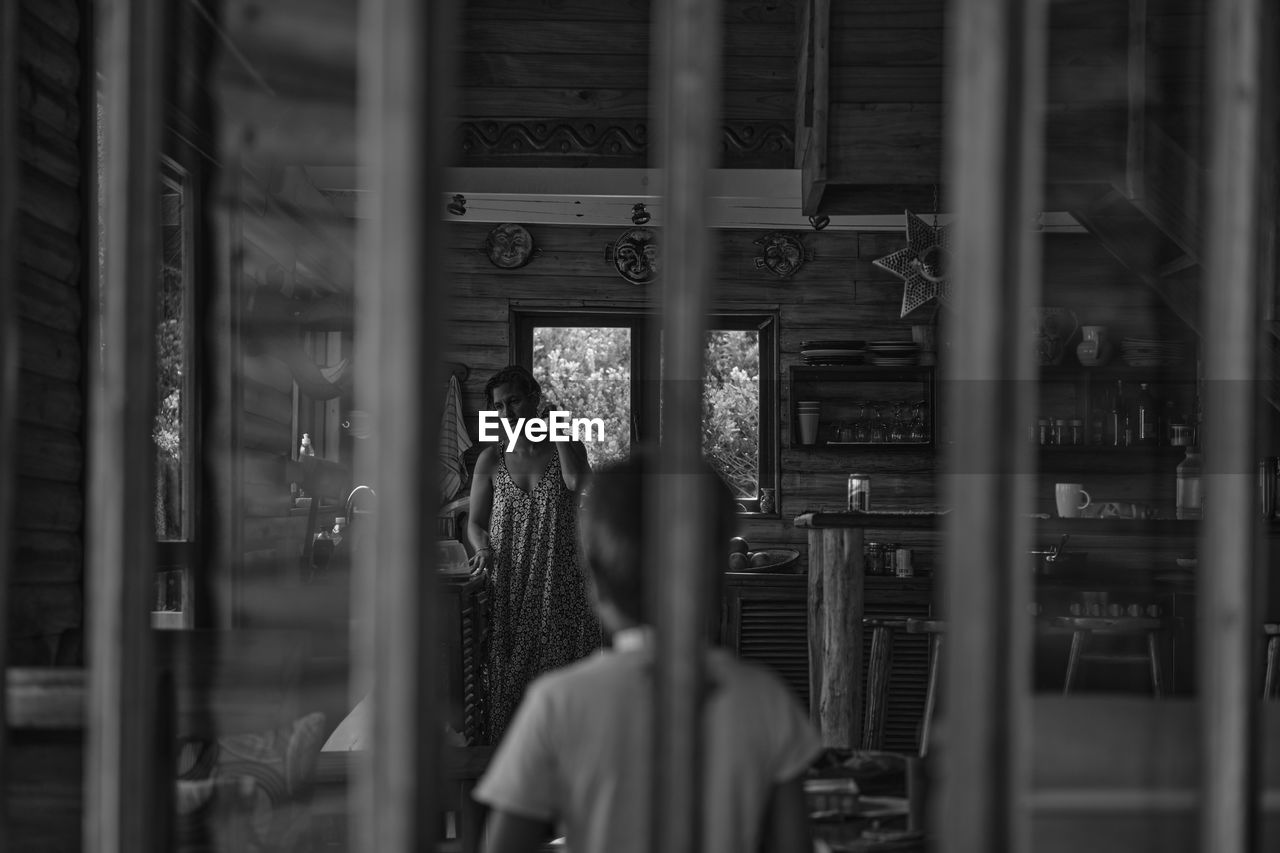 People standing in glass window