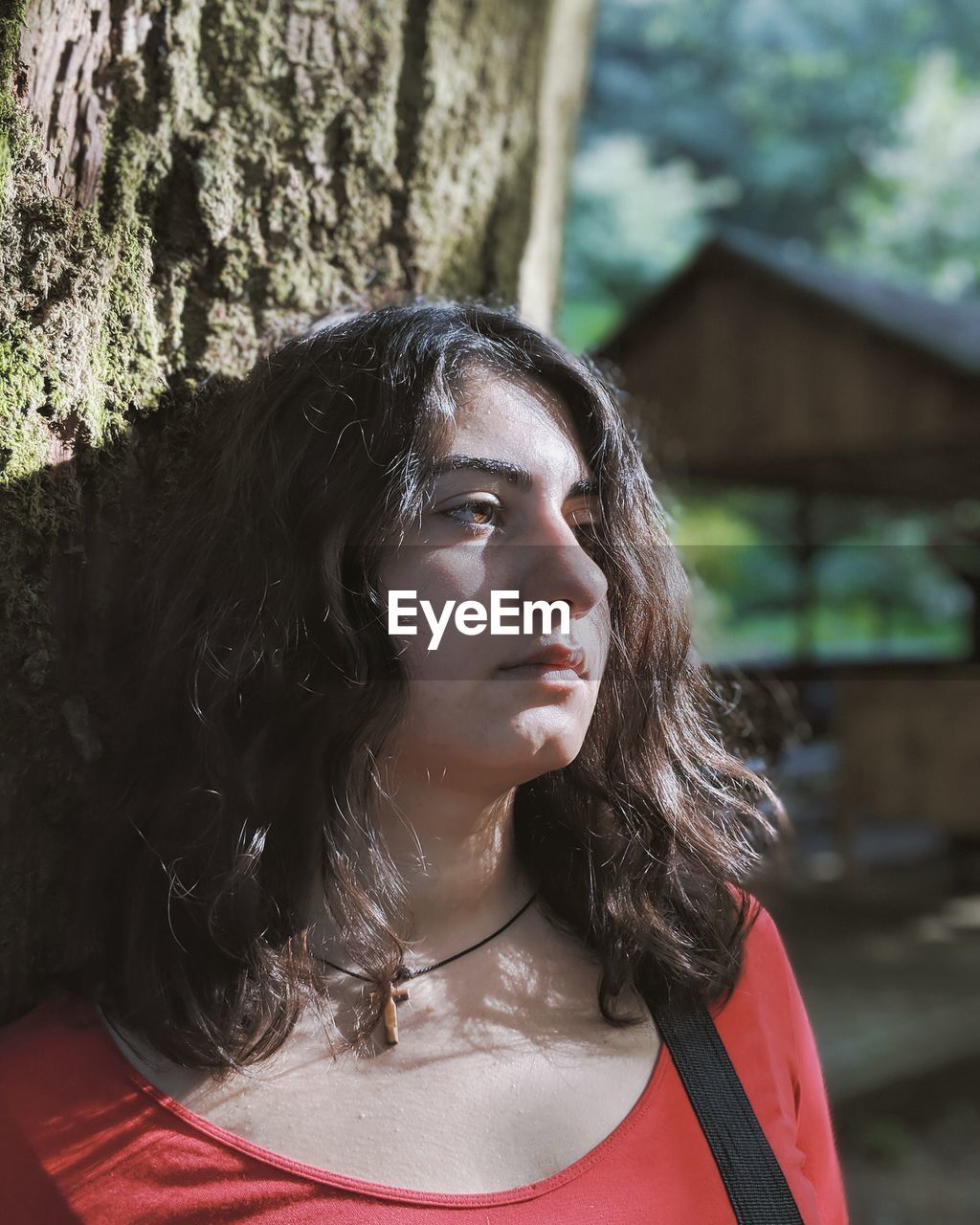 Close-up of young woman looking away