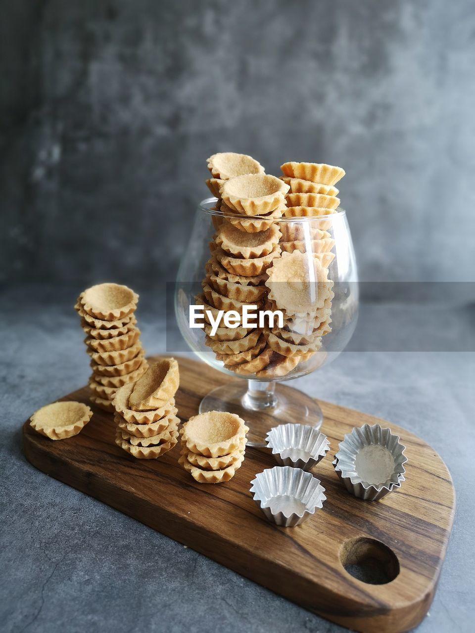 CLOSE-UP OF ICE CREAM ON WOODEN TABLE