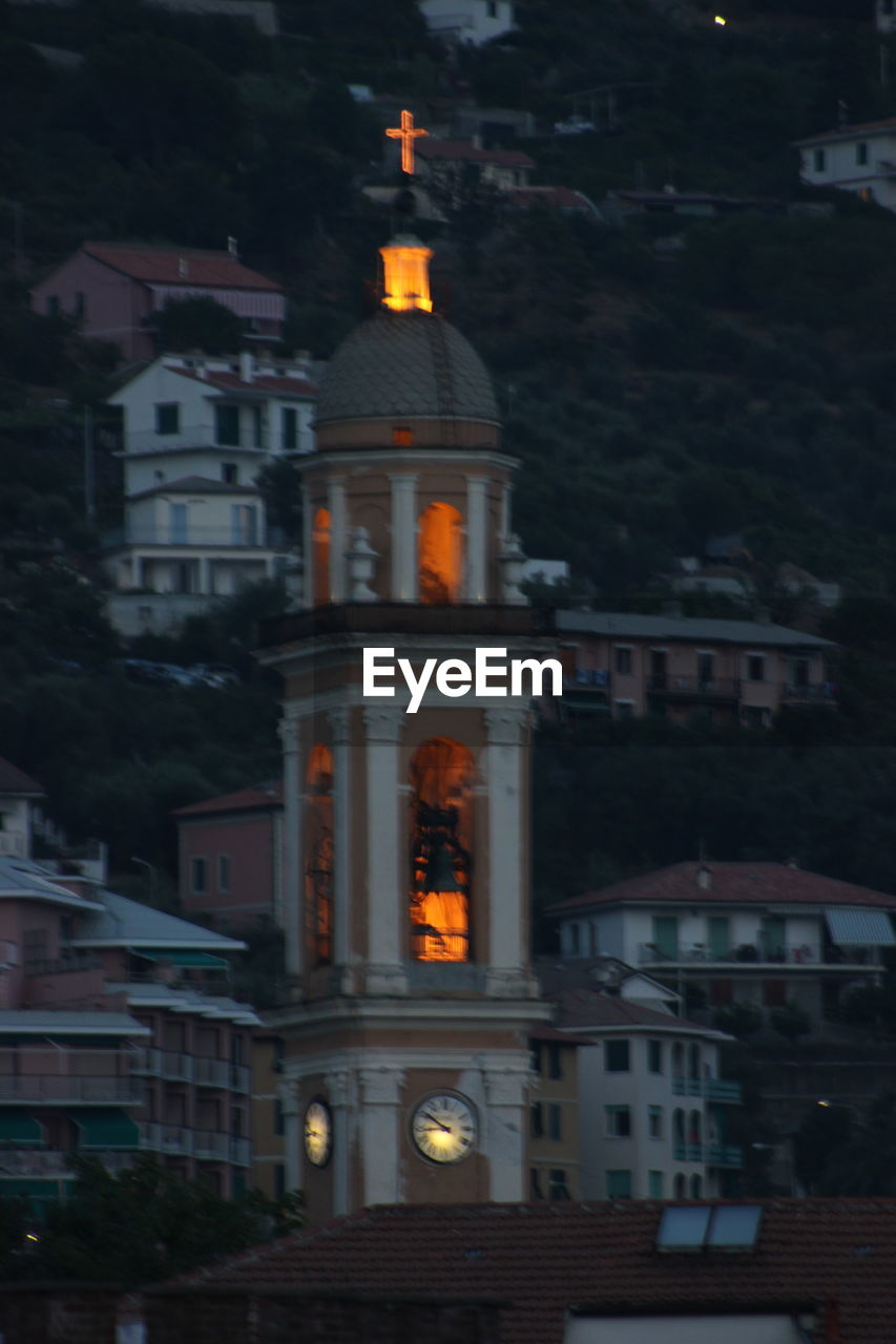 VIEW OF ILLUMINATED BUILDINGS AT NIGHT