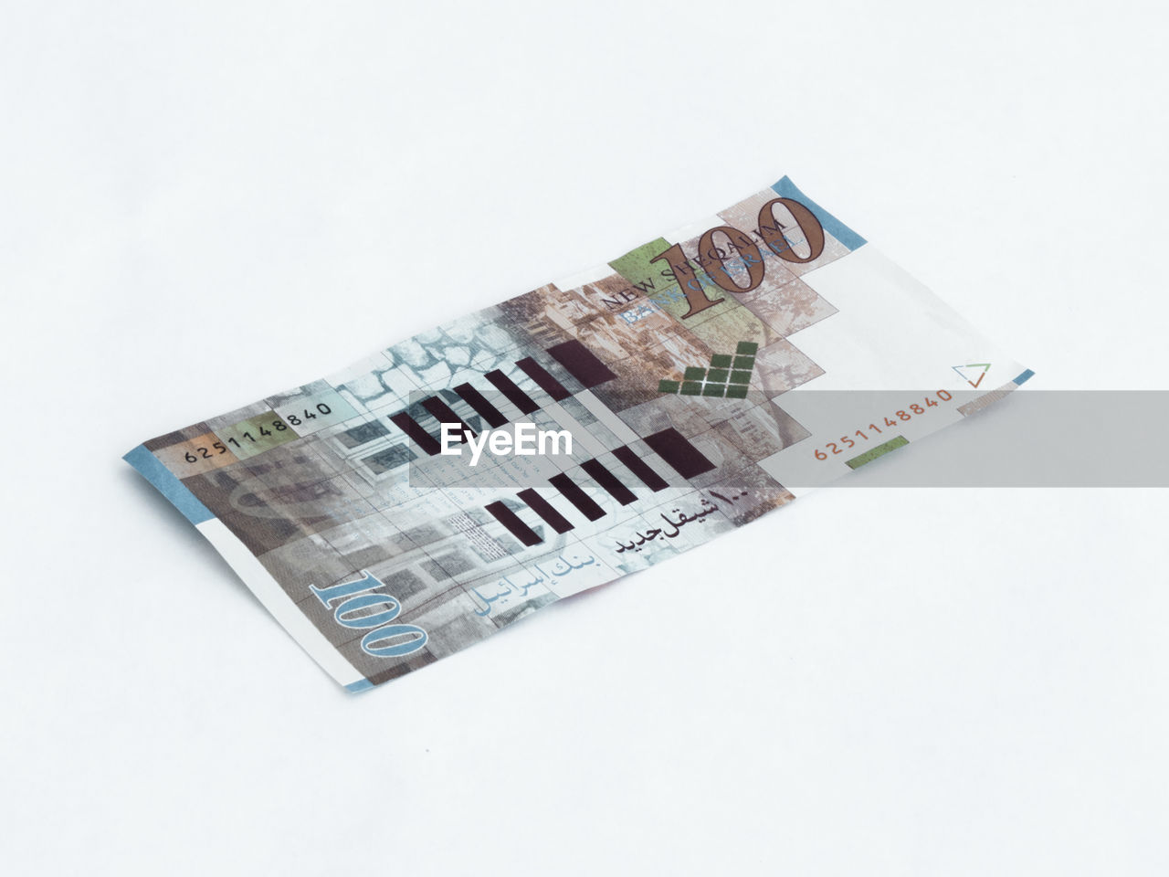 Close-up of 100 israeli shekel note on white background