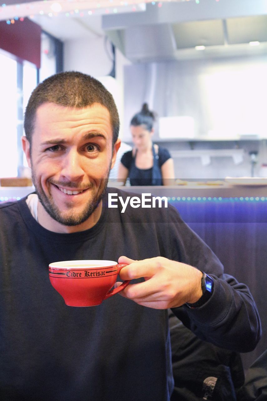 Portrait of man having coffee in cafe