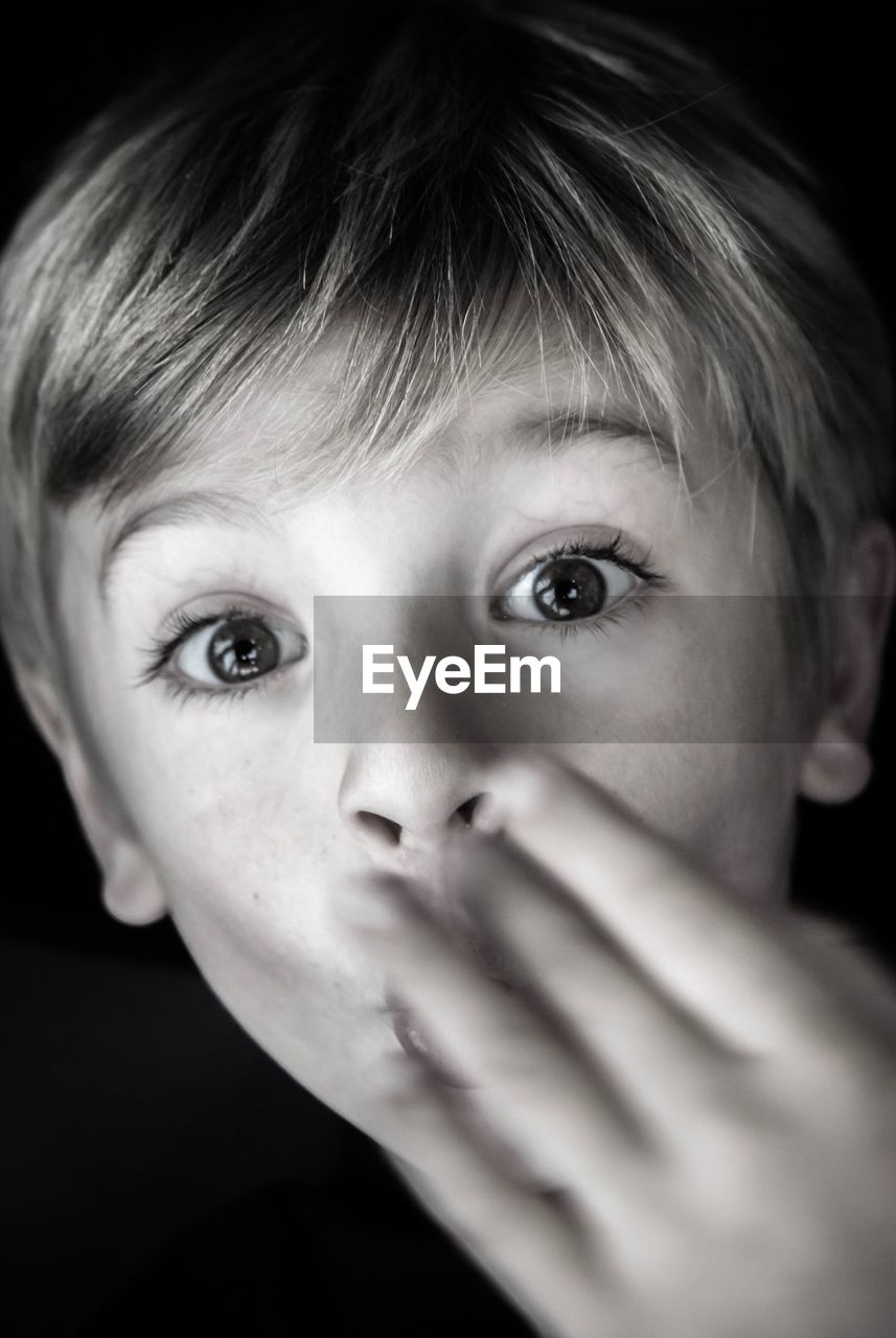 Close-up portrait of shocked boy