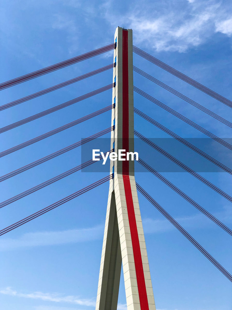 Low angle view of suspension bridge against sky