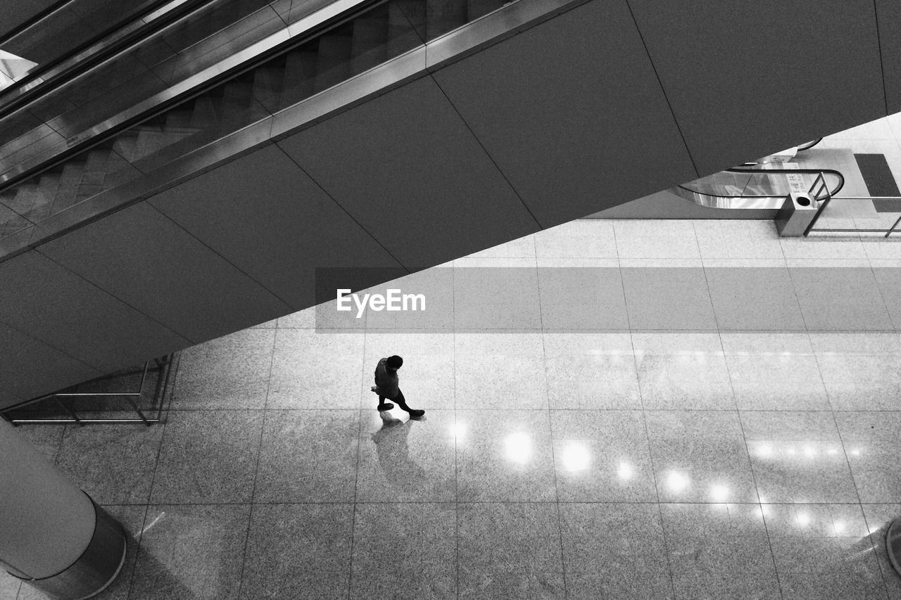 High angle view of person walking on subway platform