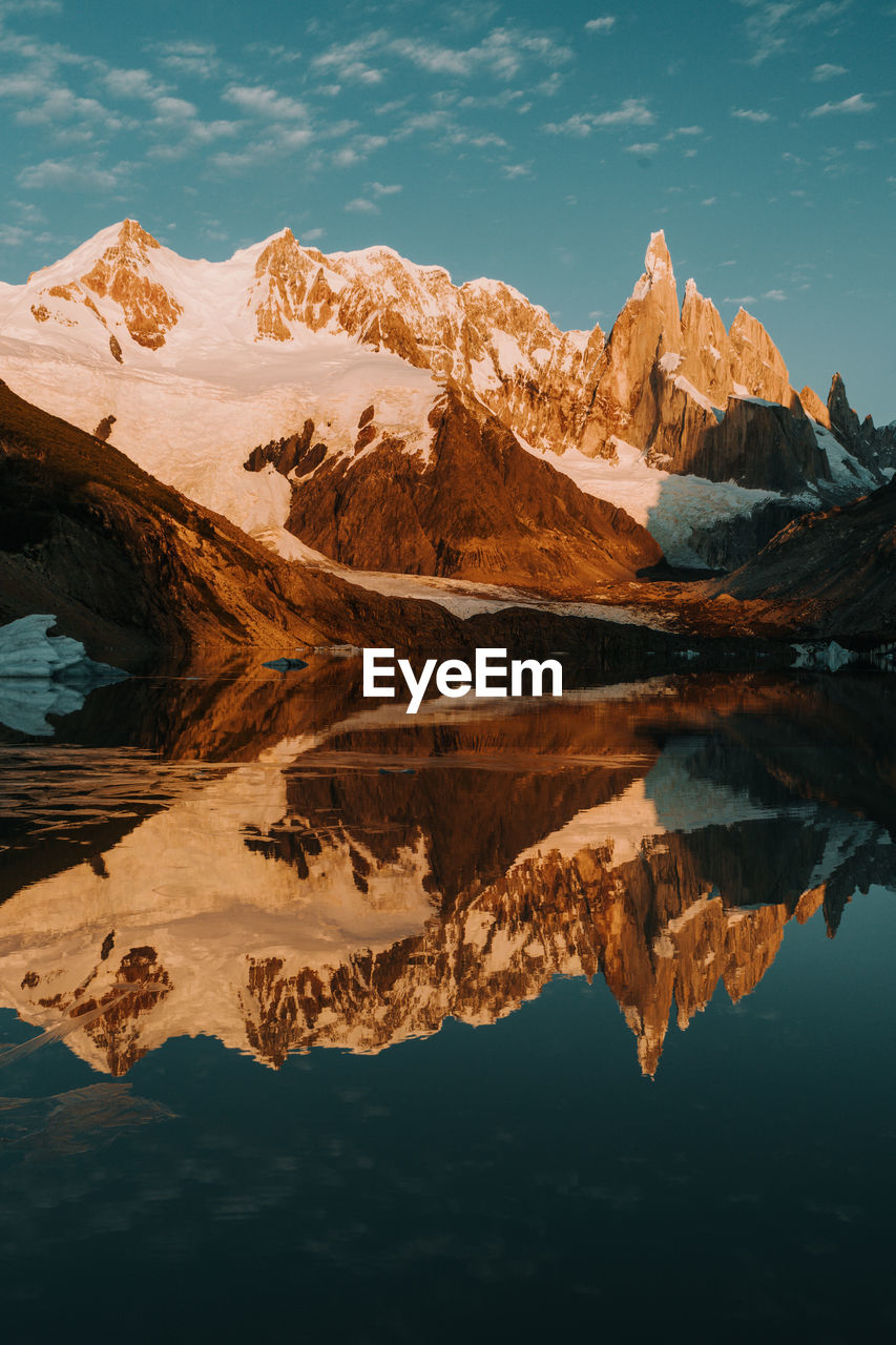 Scenic view of lake and rock mountains