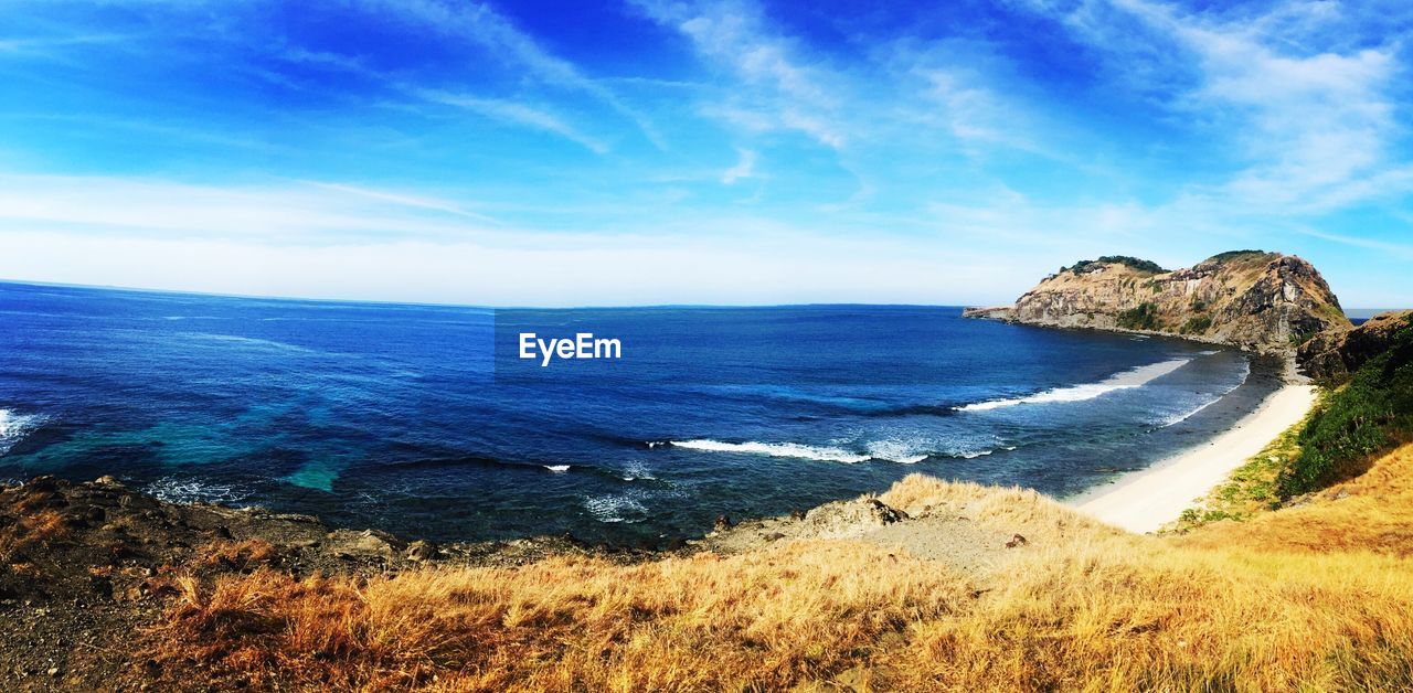 Scenic view of sea against blue sky