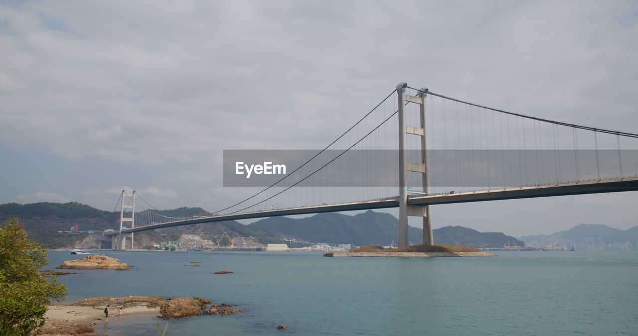 VIEW OF SUSPENSION BRIDGE OVER SEA