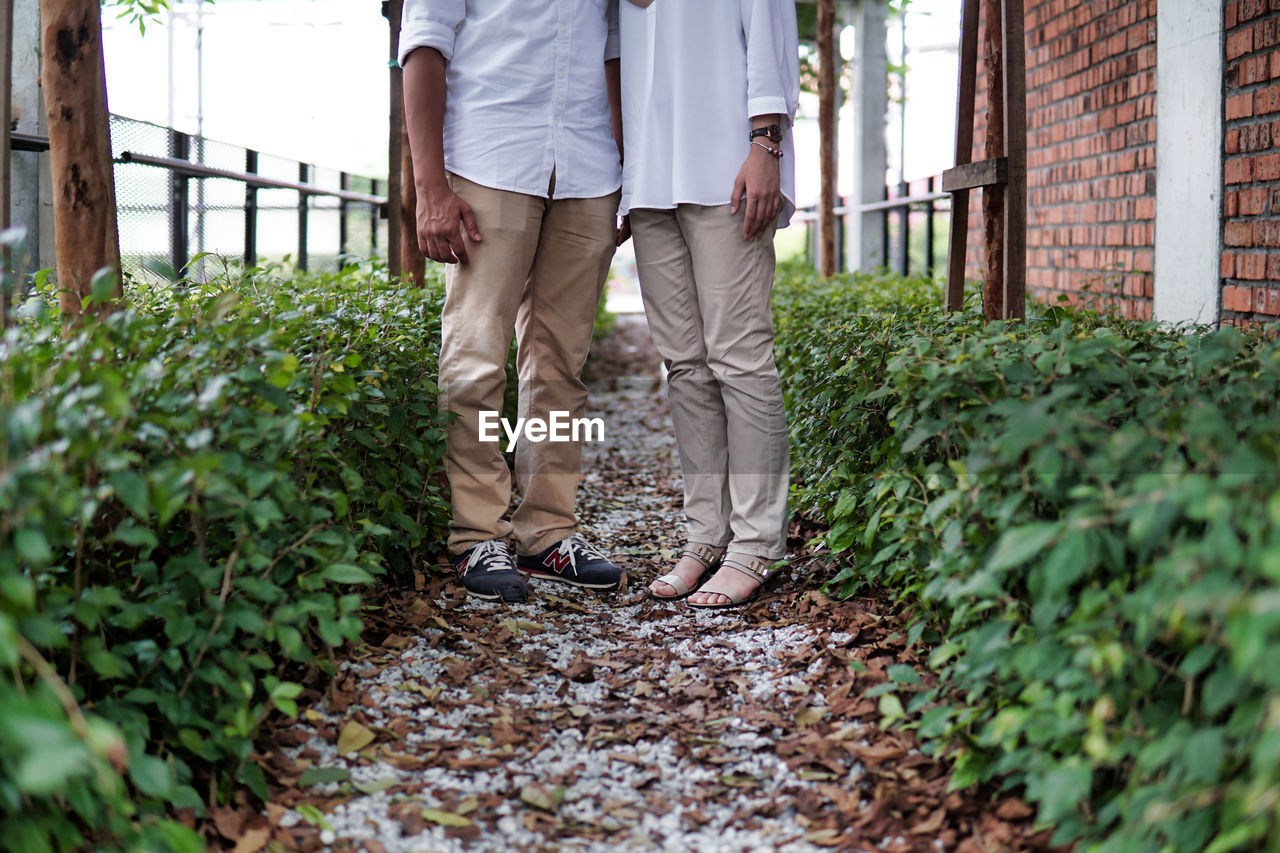 Couple standing at the gravel path