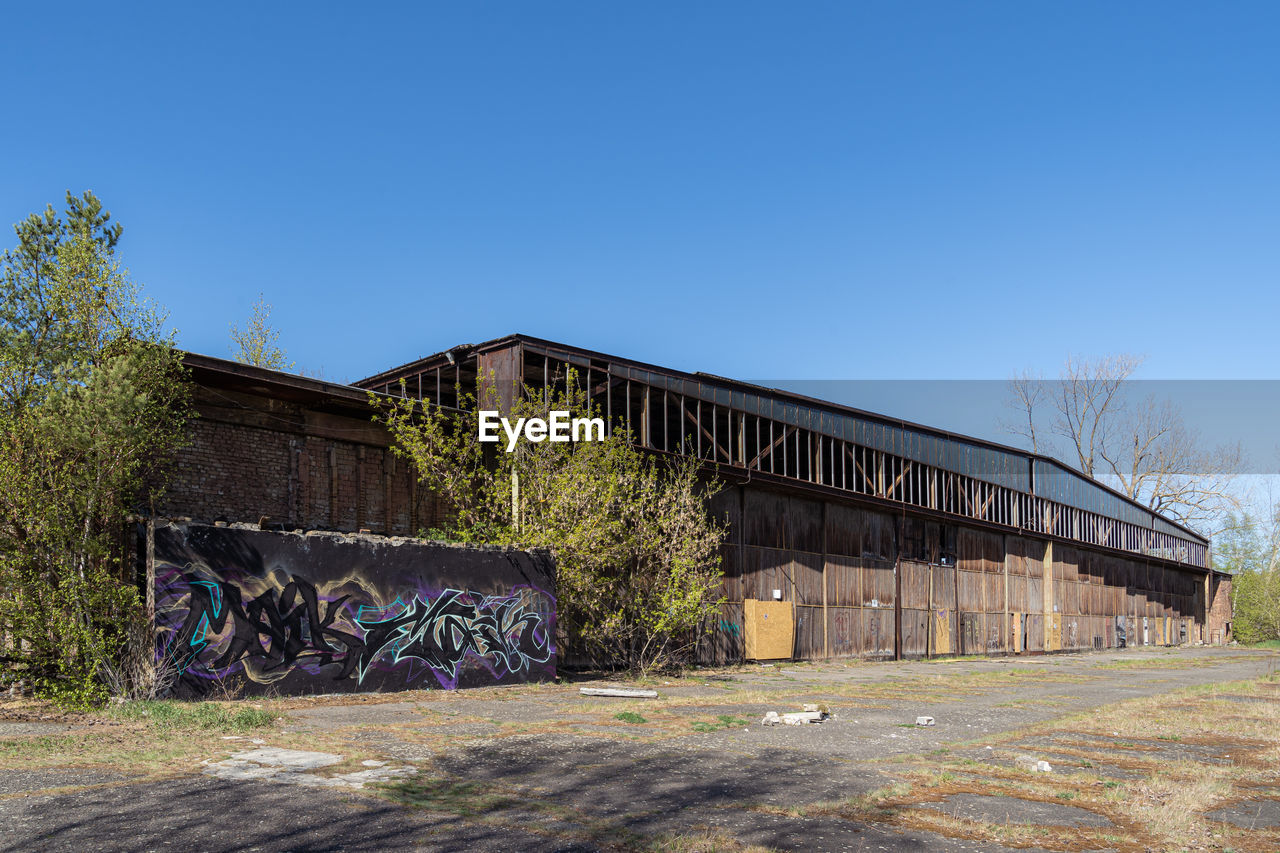 ABANDONED BUILDING AGAINST CLEAR SKY