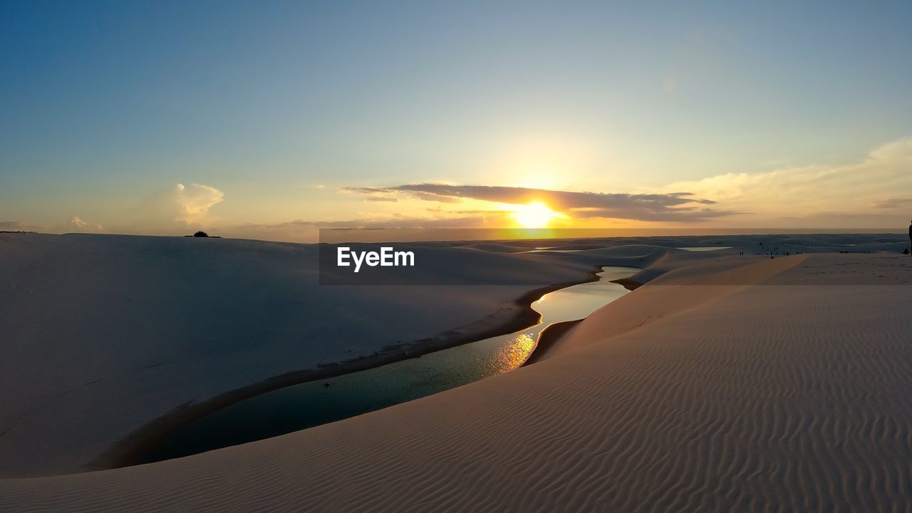 SCENIC VIEW OF DESERT DURING SUNSET