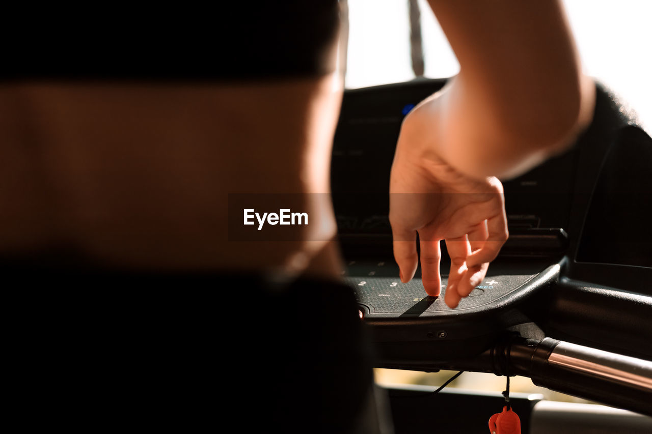 Midsection of woman exercising at gym