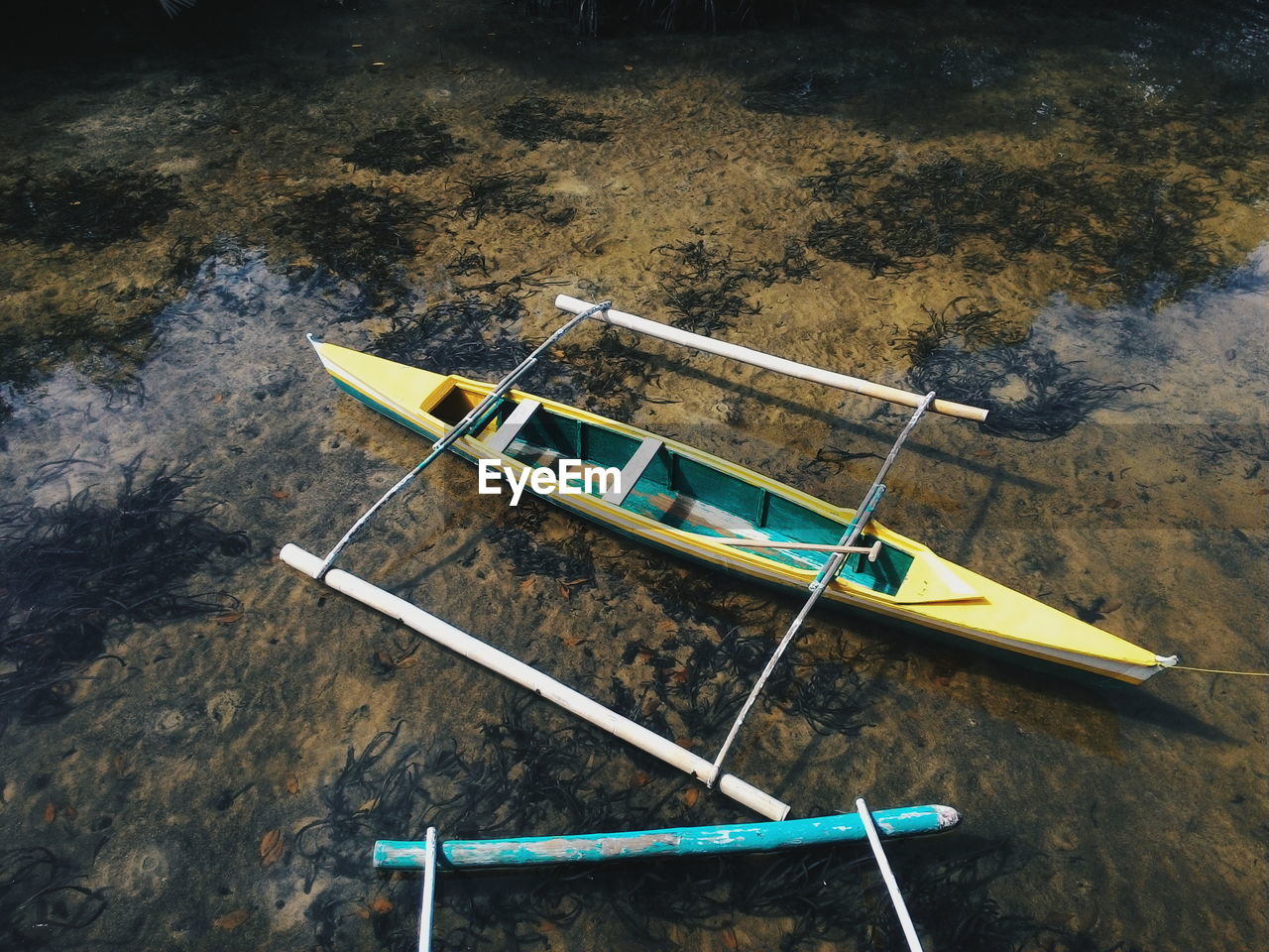 High angle view of outrigger canoe moored at sea