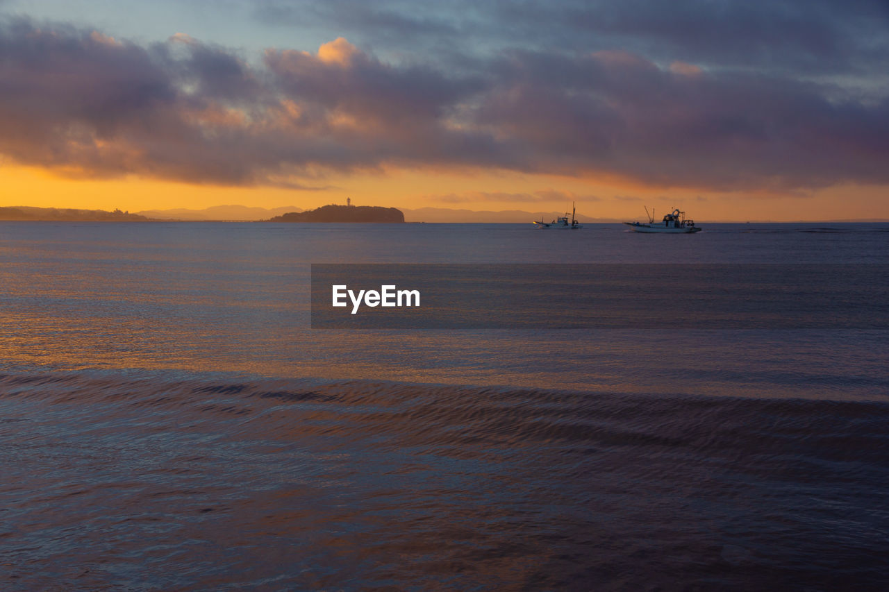 SCENIC VIEW OF SEA DURING SUNSET