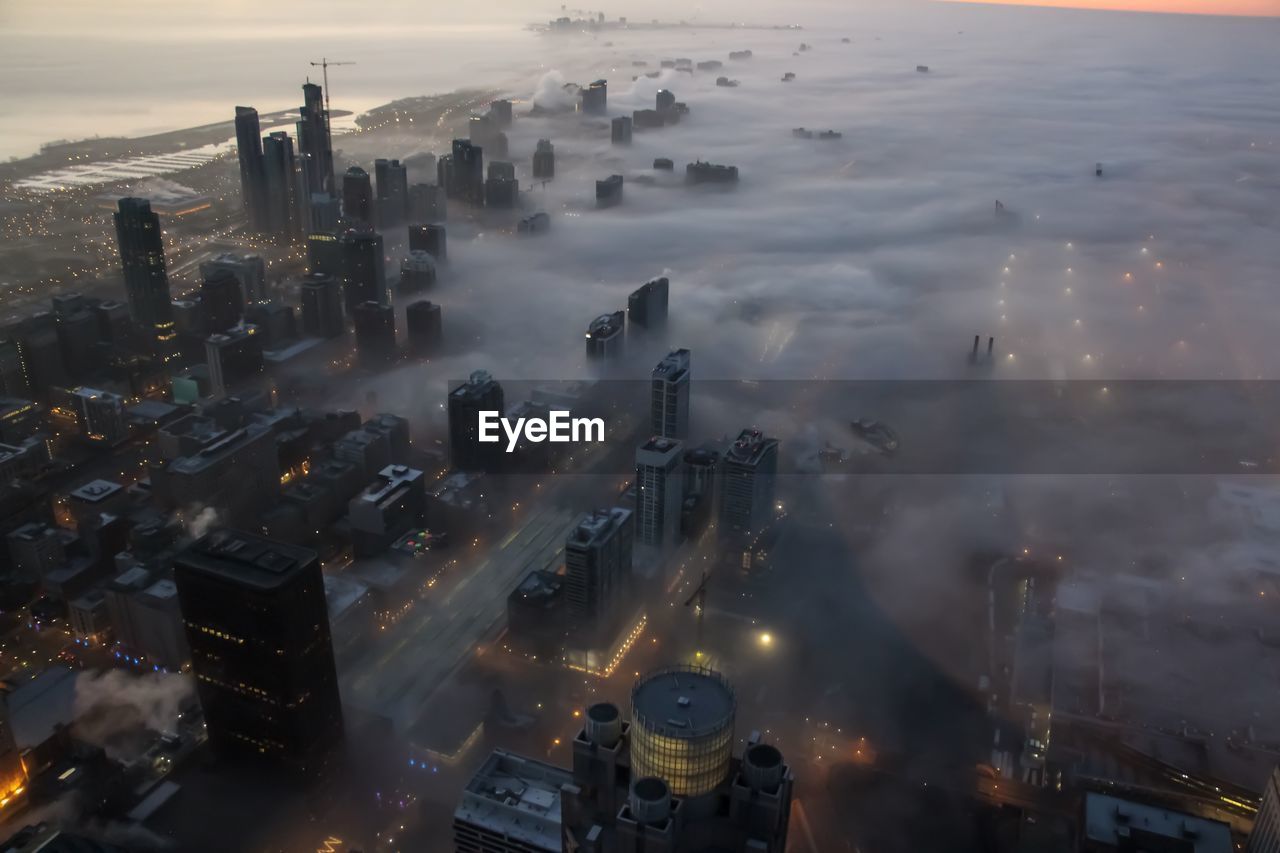 Aerial view of cityscape during foggy weather