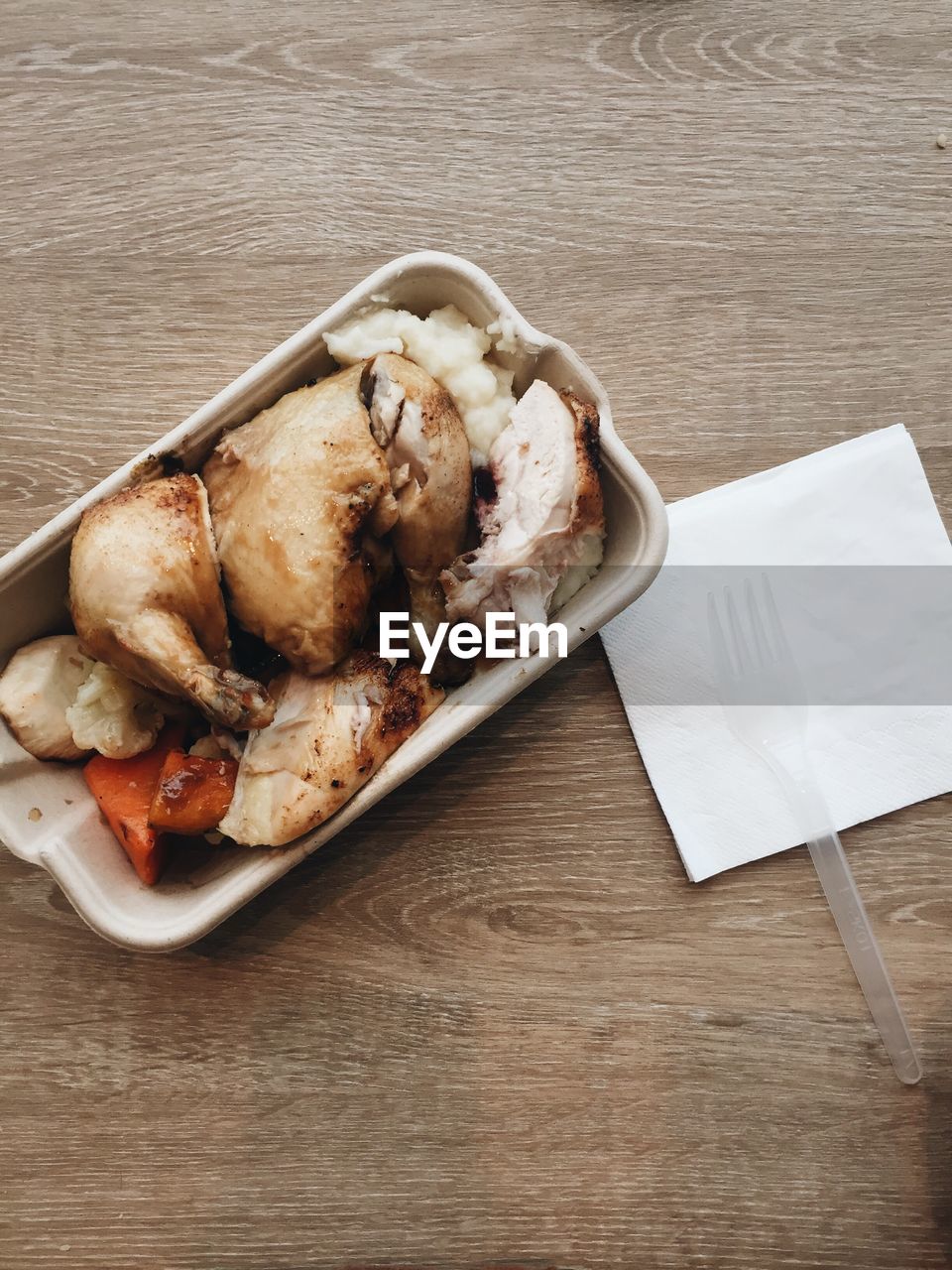 Directly above shot of meat on container on table