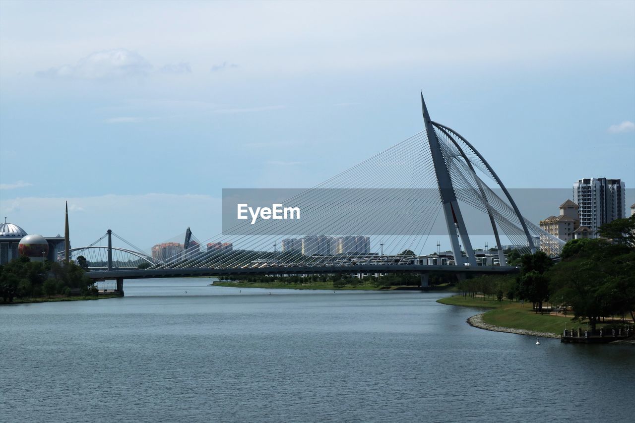 View of bridge over river in city