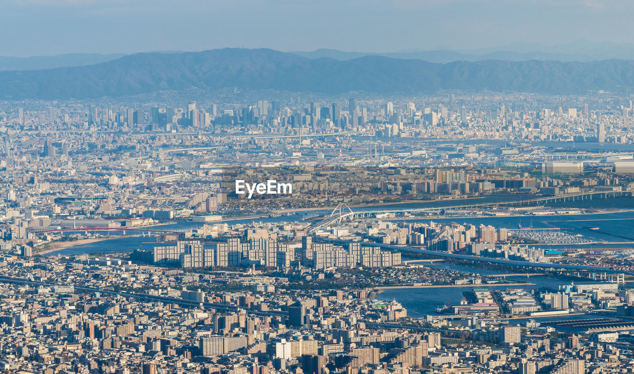 Aerial view of cityscape against sky