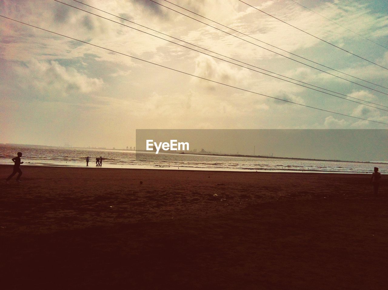 SCENIC VIEW OF BEACH DURING SUNSET