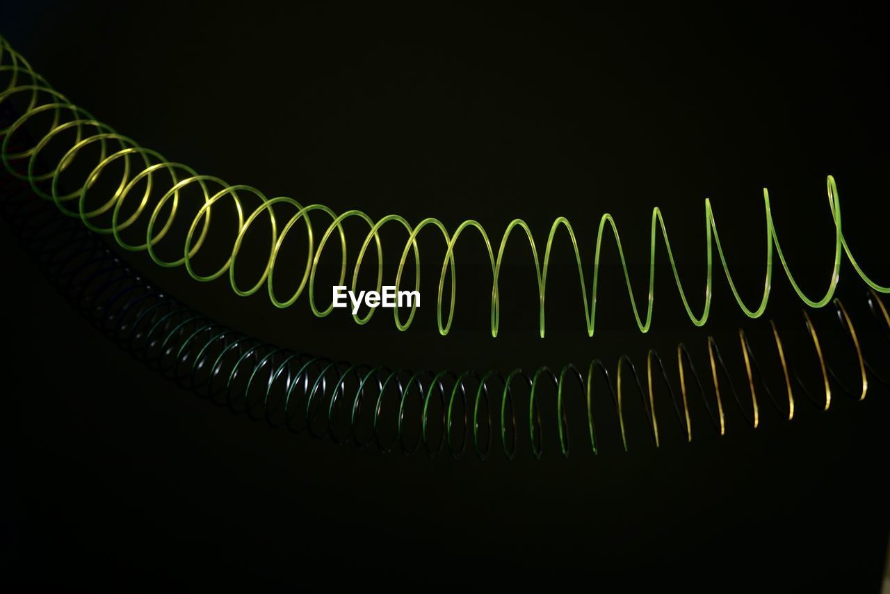 CLOSE-UP OF ILLUMINATED LIGHTING EQUIPMENT