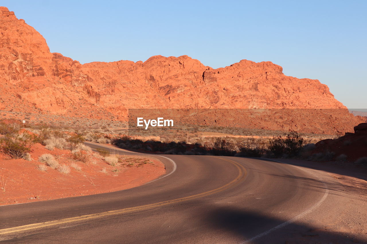 scenic view of road against clear sky