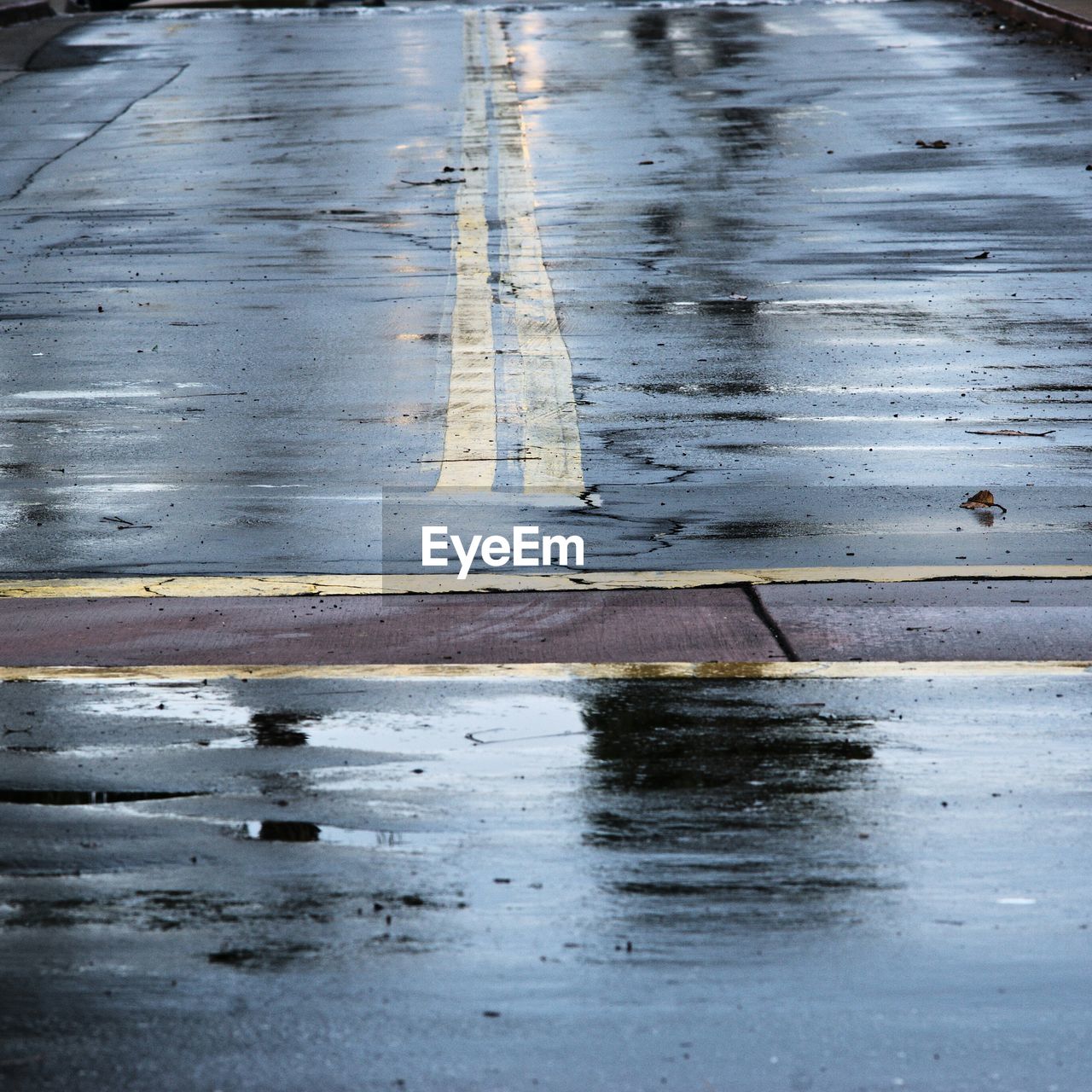 Close-up of yellow lines on road