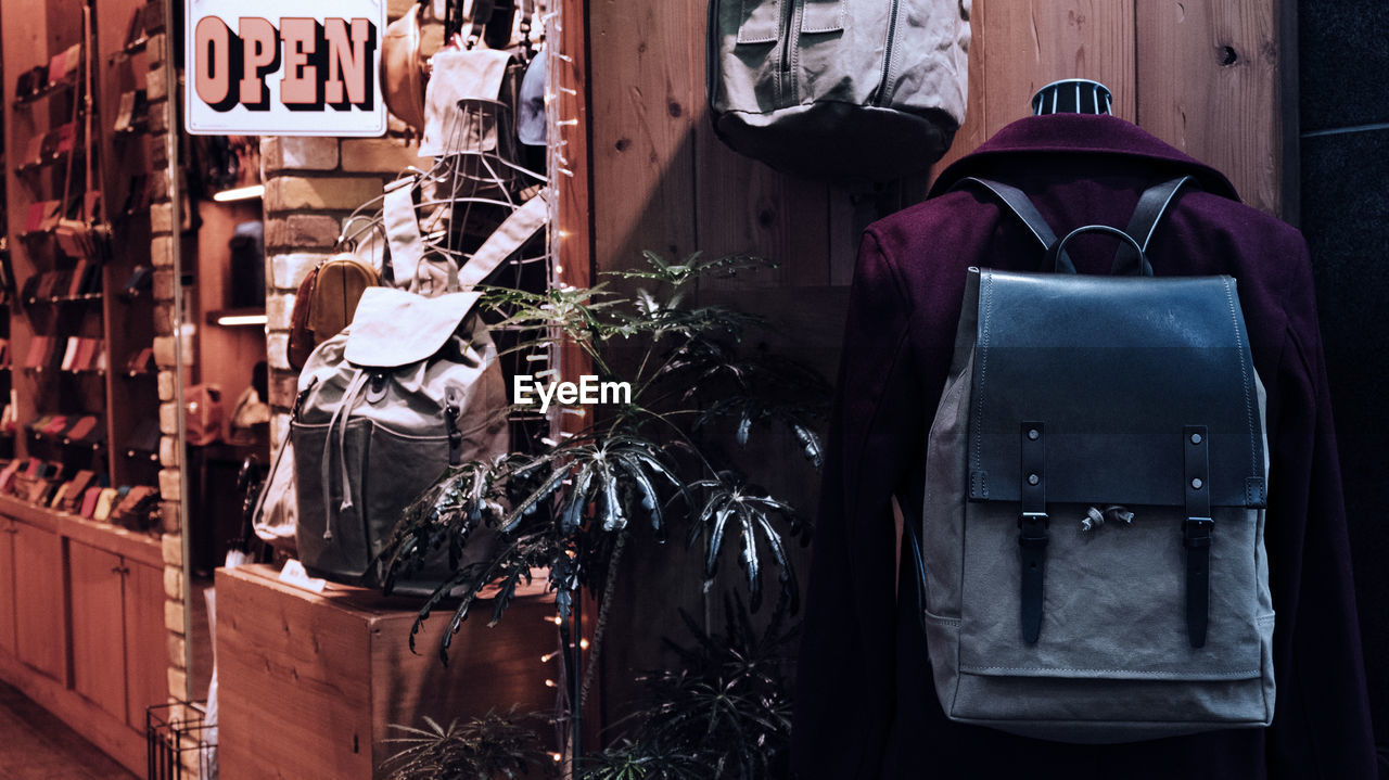 Coat with backpack hanging on wall