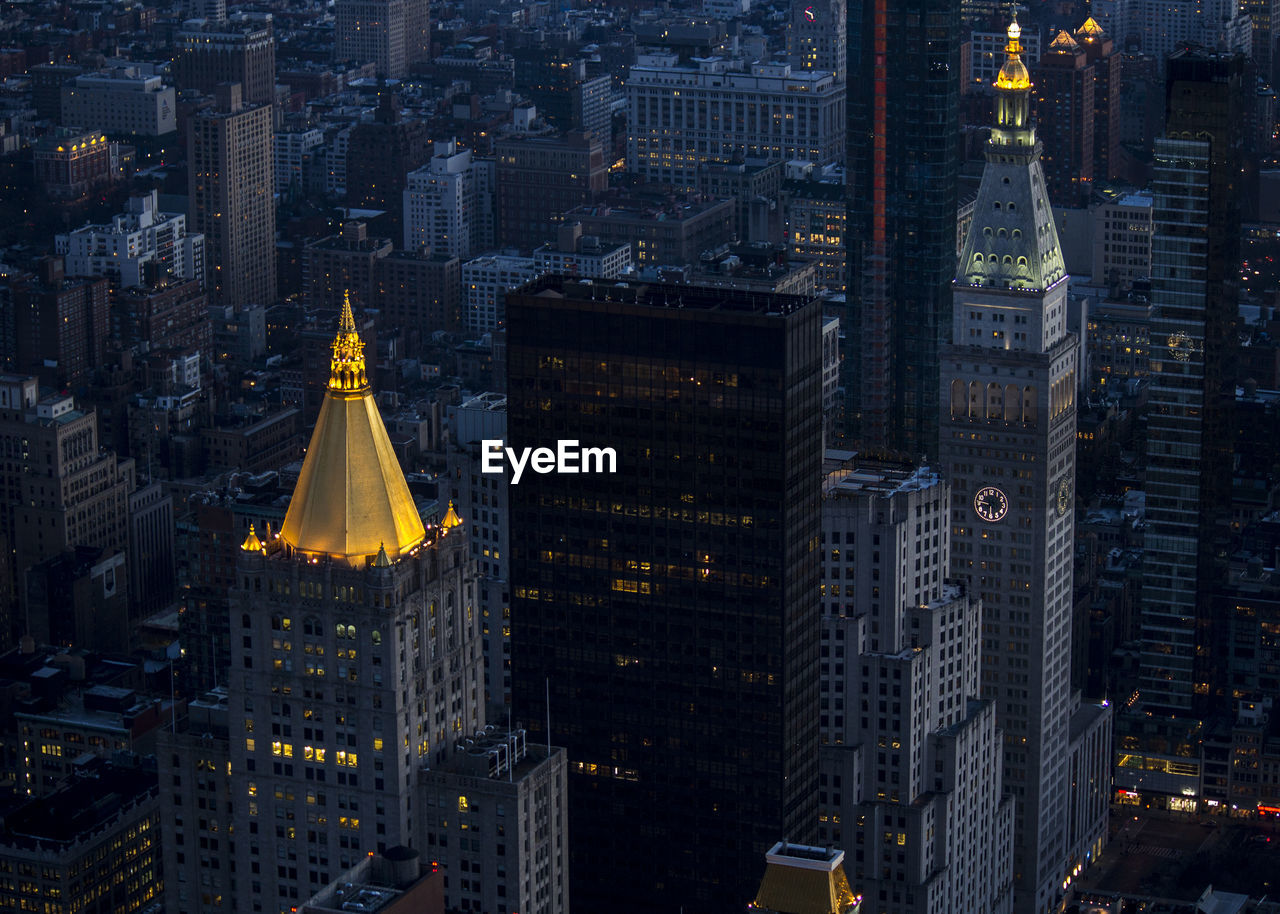 Aerial view of city lit up at night