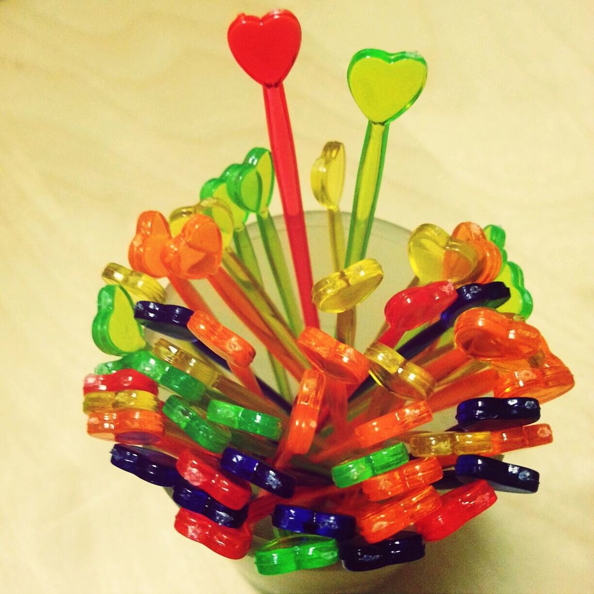 Close-up high angle view of colorful bar stirrers