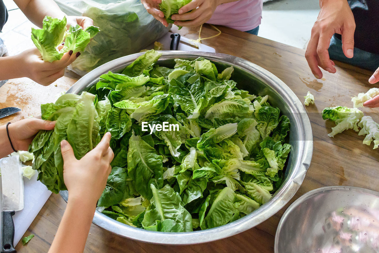 HIGH ANGLE VIEW OF PEOPLE HAVING FOOD