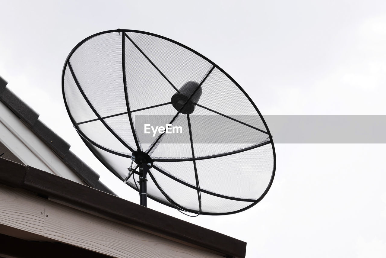 Satellite dish on house roof