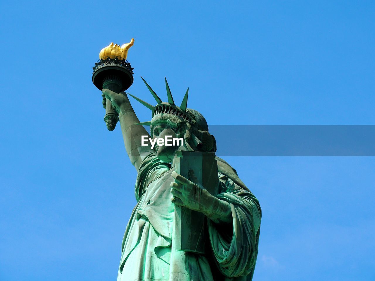 Statue of liberty against clear blue sky