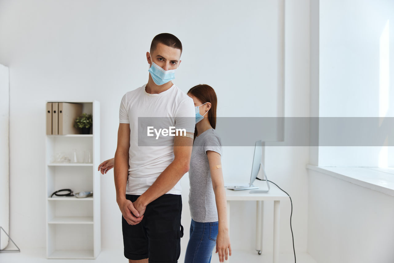 Young couple standing at home