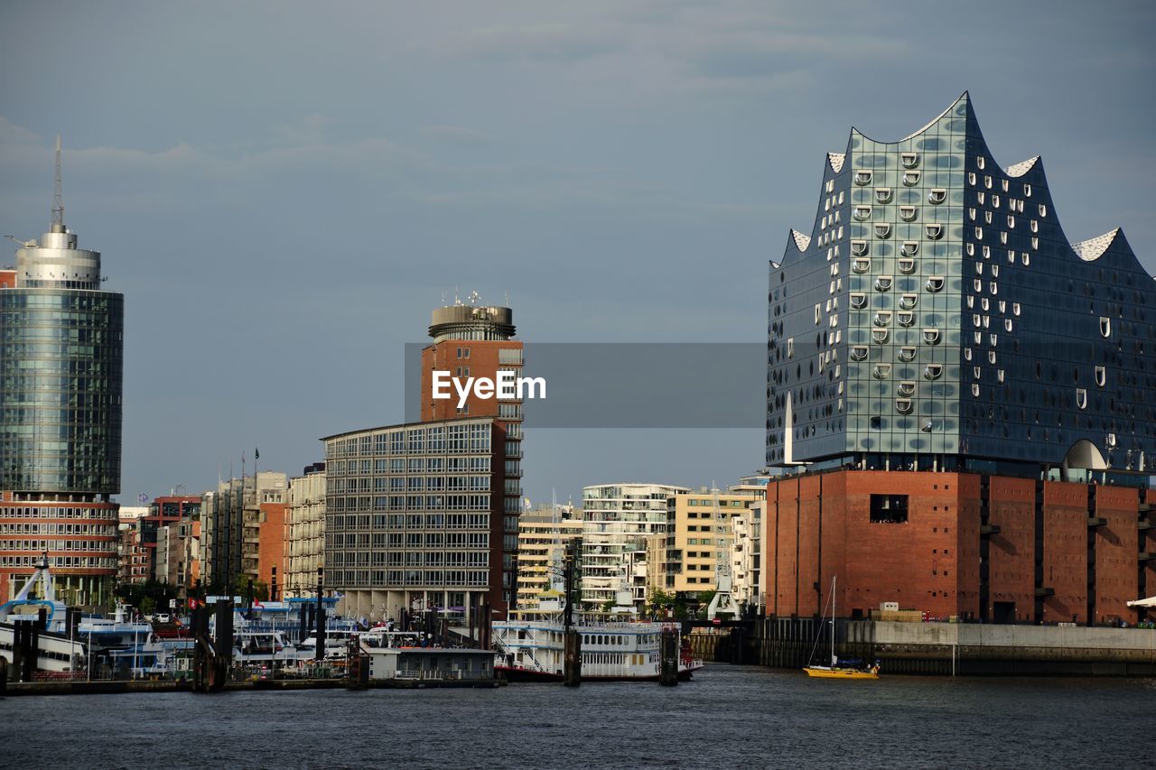 View of buildings against cloudy sky