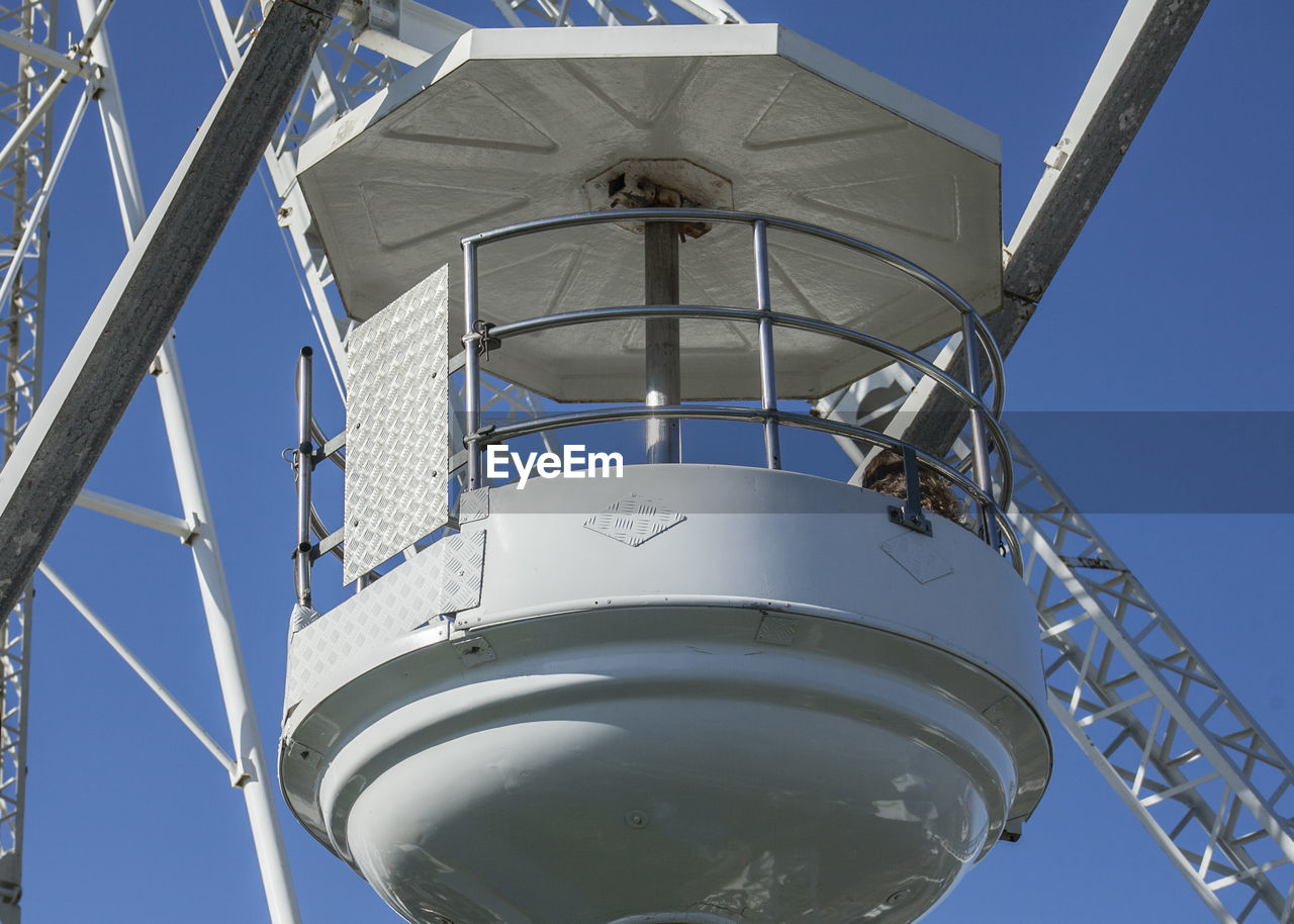 Low angle view of tower against clear blue sky