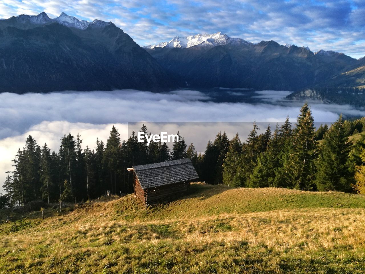 Scenic view of landscape and mountains against sky