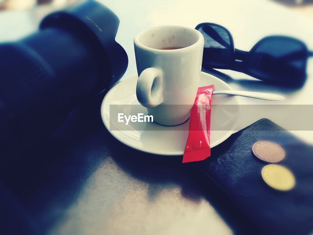 CLOSE-UP OF COFFEE CUP ON WHITE TABLE