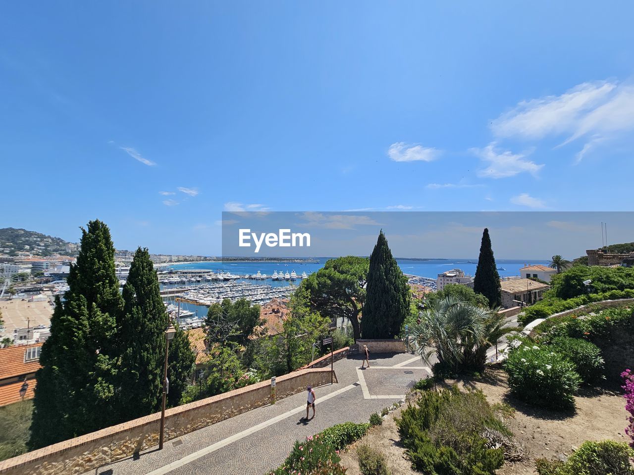 architecture, sky, vacation, built structure, nature, plant, building exterior, city, travel destinations, tree, tourism, building, travel, blue, landmark, water, road, history, no people, the past, cloud, day, cityscape, outdoors, landscape, high angle view, transportation, religion, sunny, sea, street, scenics - nature, beauty in nature, place of worship, hill, sunlight, environment, estate, clear sky