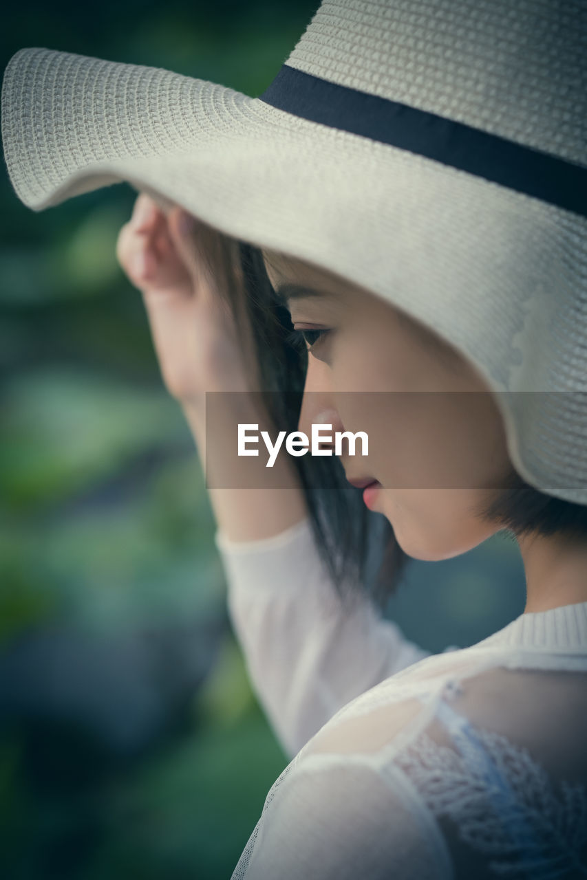 Close-up of woman wearing hat