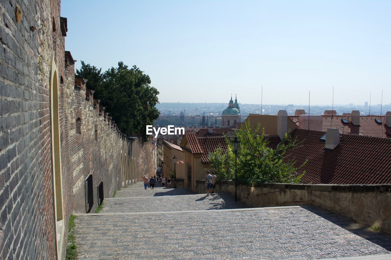 Walkway along buildings overlooking city