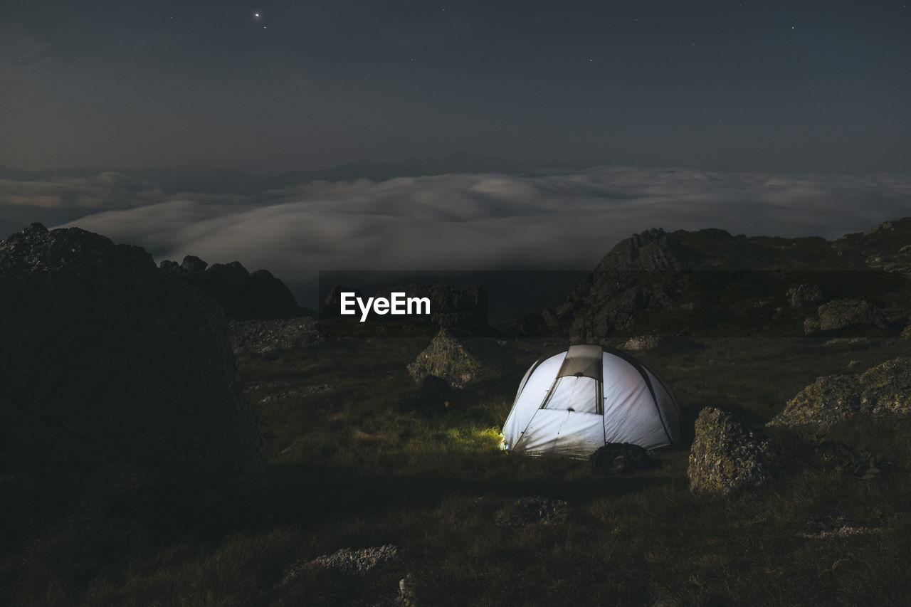 Mountain camping at night watching clouds unroll, cantabria, spain