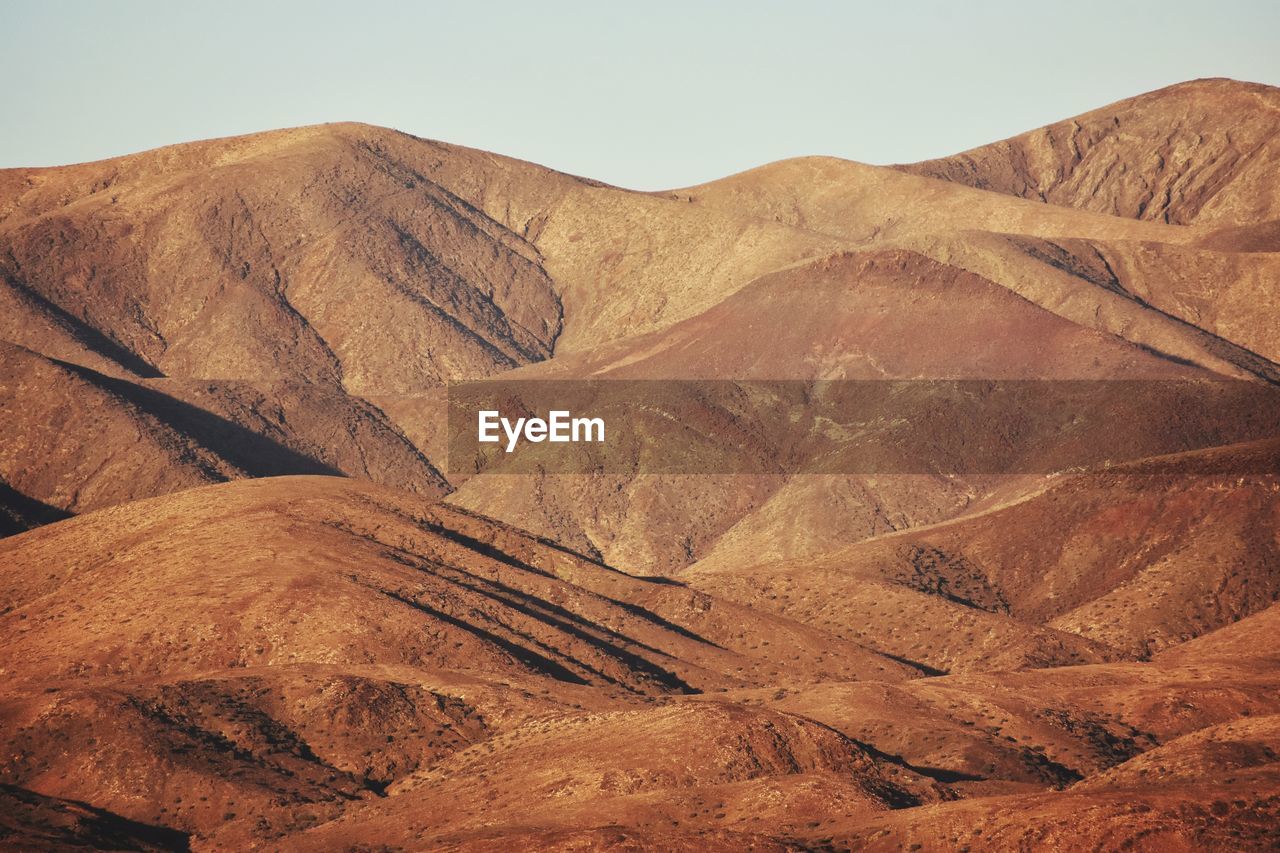 Scenic view of desert against clear sky