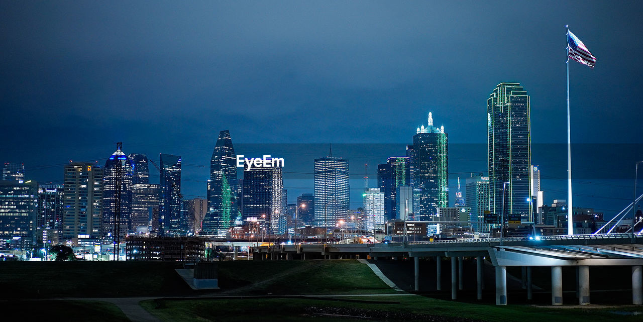 illuminated buildings in city at night