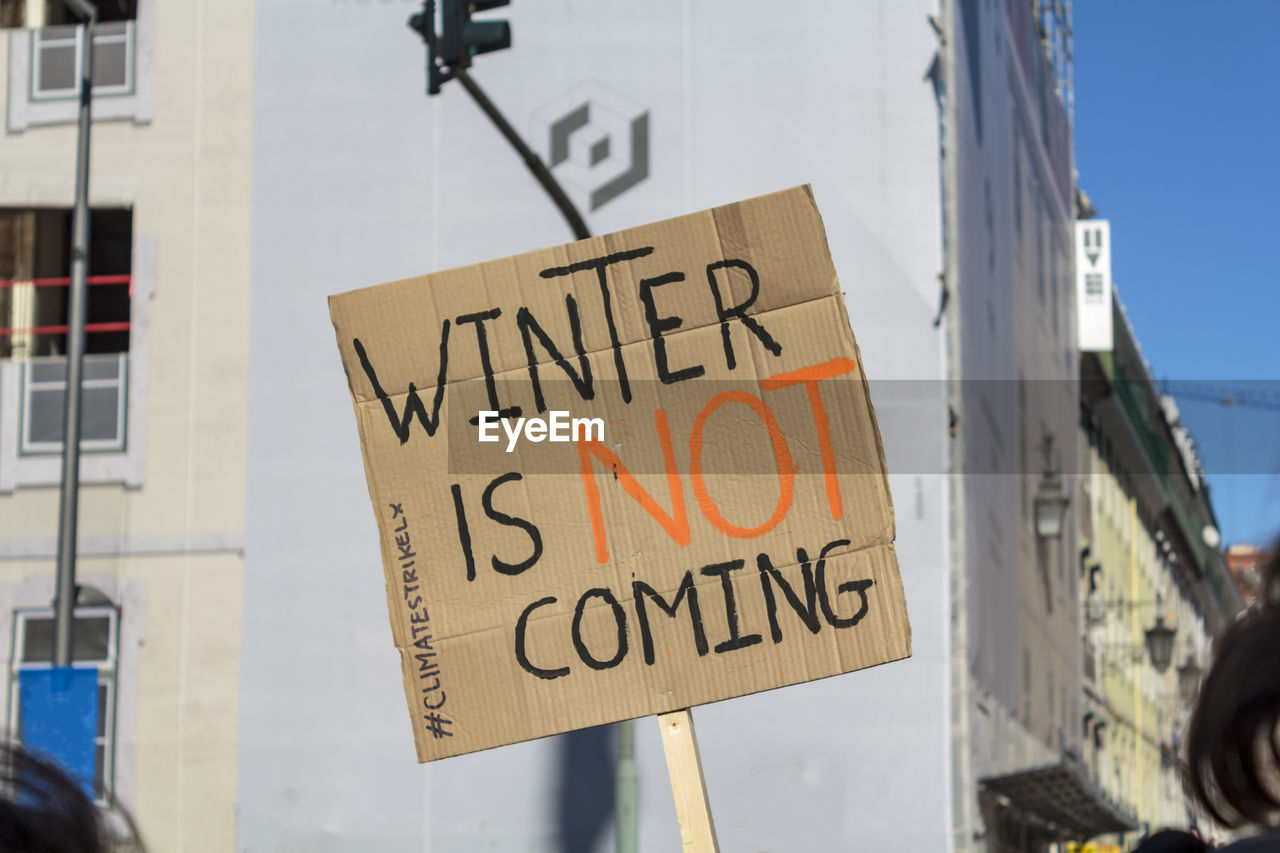 Sign saying winter is not coming in protest for climate changes