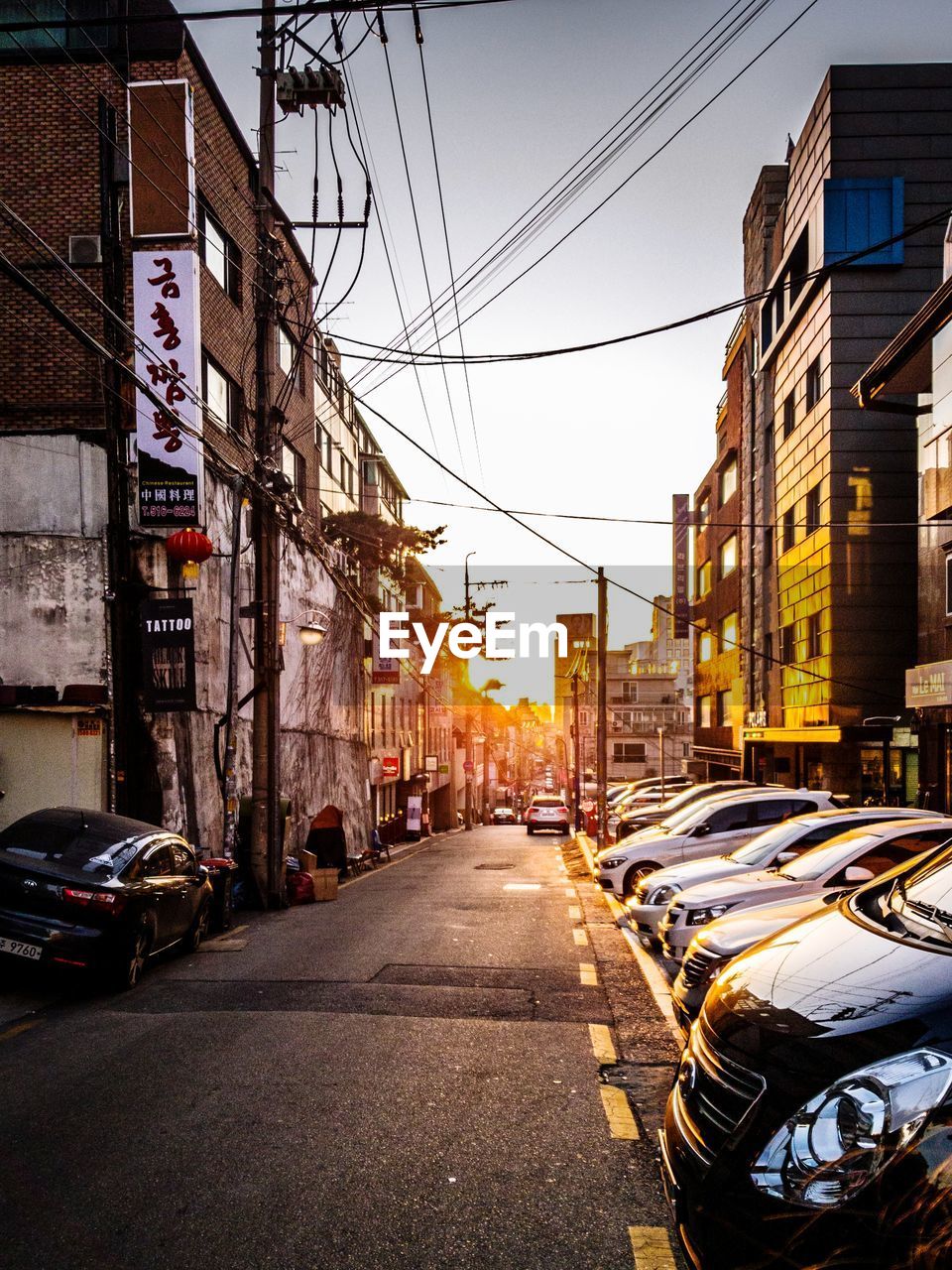 View of city street and buildings against sky