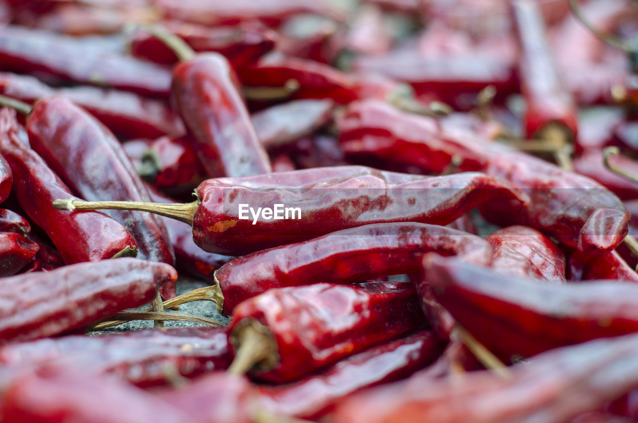 FULL FRAME SHOT OF RED CHILI PEPPERS AT MARKET