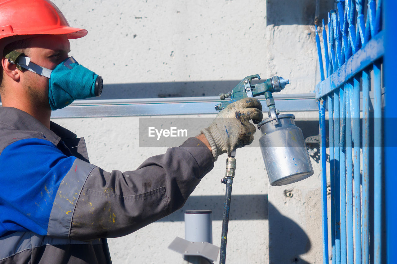 side view of man working at factory