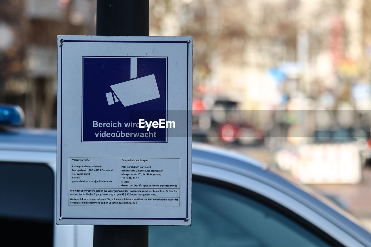 CLOSE-UP OF INFORMATION SIGN ON CAR