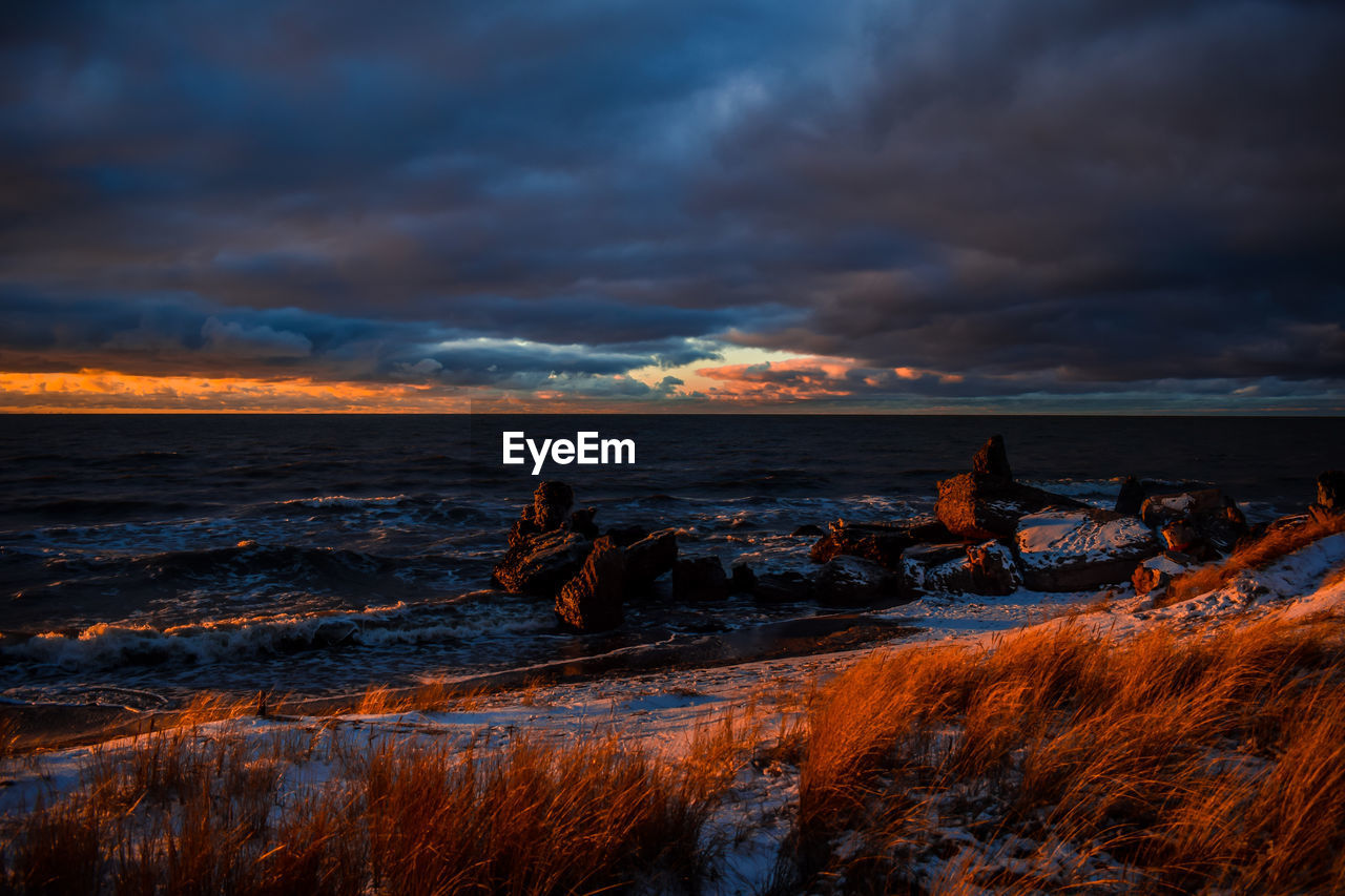 SCENIC VIEW OF SEA DURING SUNSET