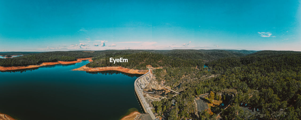 Scenic view of lake against blue sky